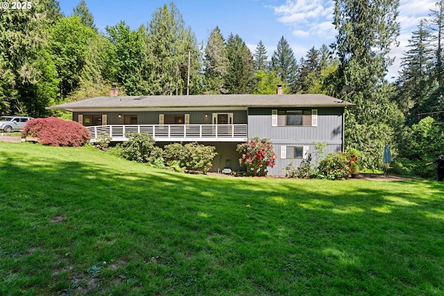 view of front of house featuring a front yard and a chimney