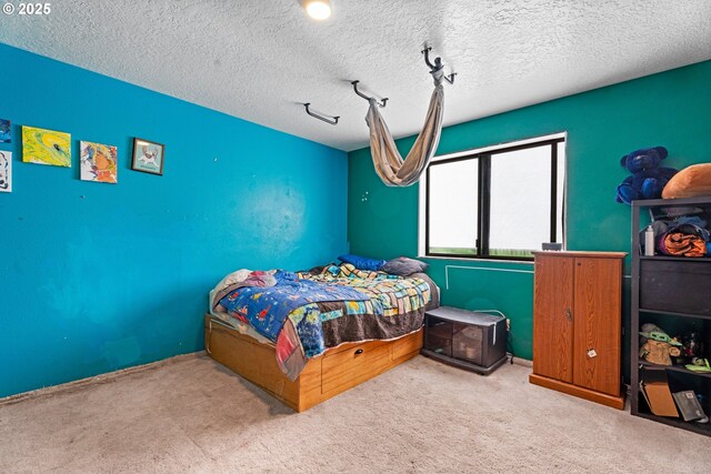 bedroom featuring carpet and rail lighting