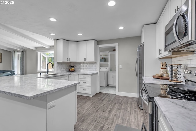 1388 Hillendale Dr, Salem, OR 97302 - kitchen with stainless steel appliances, light stone counters, recessed lighting, backsplash, and white cabinetry
