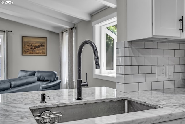 1388 Hillendale Dr, Salem, OR 97302 - kitchen view of decorative backsplash, light stone countertops, and white cabinetry
