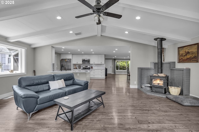 1388 Hillendale Dr, Salem, OR 97302 - living area with wood finished floors, recessed lighting, ceiling fan, and a wood stove