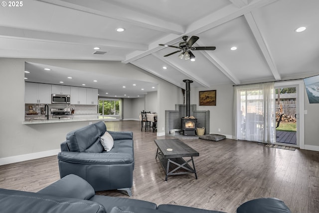 1388 Hillendale Dr, Salem, OR 97302 - living room featuring a wood stove, recessed lighting, wood finished floors, and a ceiling fan