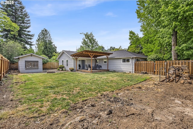 1388 Hillendale Dr, Salem, OR 97302 - back of house with a pergola, a fenced backyard, an outdoor structure, and a patio area