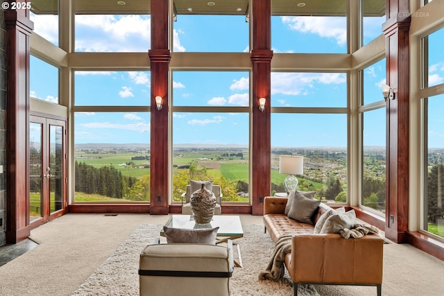 45585 NW David Hill Rd, Forest Grove, OR 97116 - living room with a high ceiling, a ceiling fan, decorative columns, a tile fireplace, and stairway