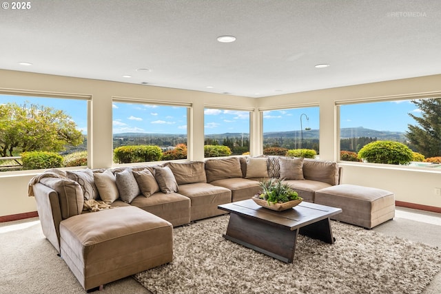 45585 NW David Hill Rd, Forest Grove, OR 97116 - carpeted living area with baseboards, plenty of natural light, recessed lighting, and a mountain view