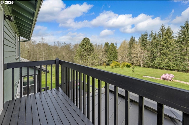 wooden terrace with a yard