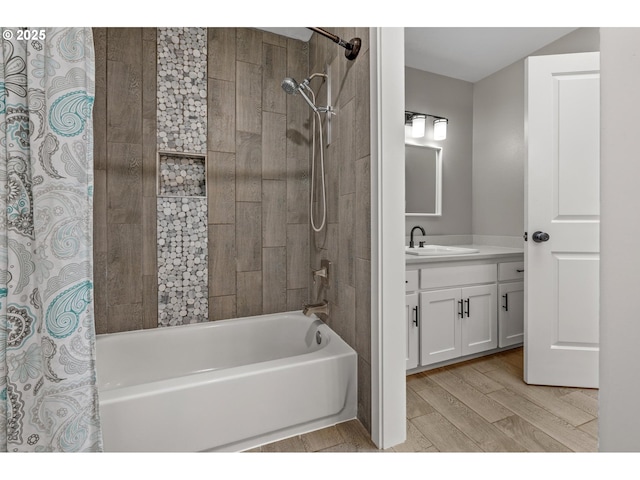 full bath with vanity, shower / bath combo, and wood finished floors