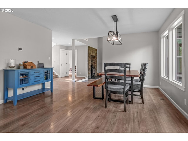 dining room with baseboards, dark wood-style floors, and visible vents