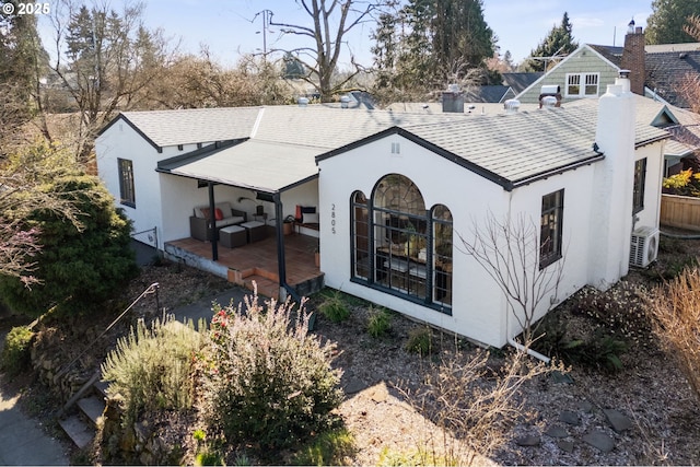 rear view of property with stucco siding