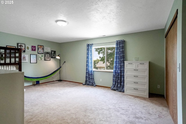 2395 88th Ave NE, Salem, OR 97305 - unfurnished bedroom featuring carpet flooring and a textured ceiling