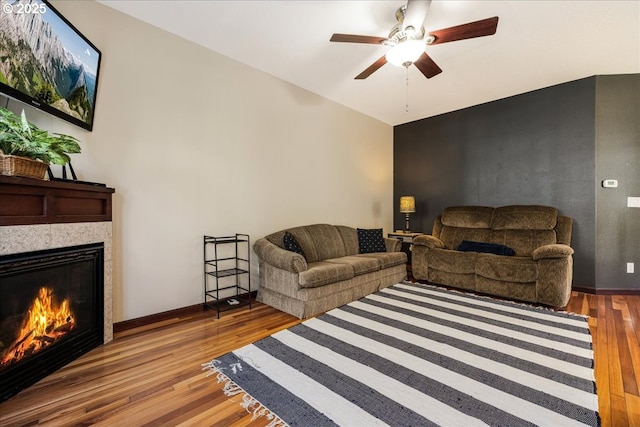 810 E 9th St Unit E18, Newberg, OR 97132 - living area with wood finished floors, a tile fireplace, and a ceiling fan