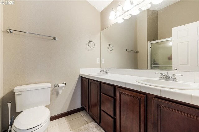 810 E 9th St Unit E18, Newberg, OR 97132 - bathroom featuring toilet, tile patterned flooring, double vanity, a shower stall, and baseboards