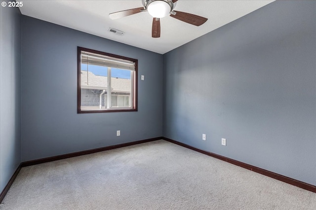 810 E 9th St Unit E18, Newberg, OR 97132 - unfurnished room featuring carpet, baseboards, and a ceiling fan