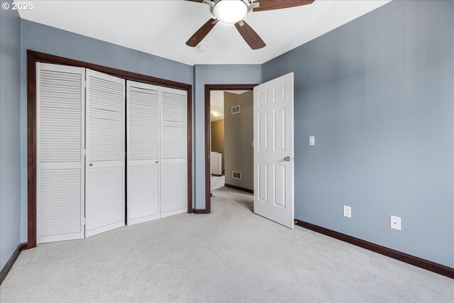810 E 9th St Unit E18, Newberg, OR 97132 - unfurnished bedroom featuring light carpet, baseboards, a closet, and ceiling fan