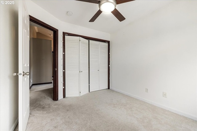 810 E 9th St Unit E18, Newberg, OR 97132 - unfurnished bedroom with carpet, a closet, baseboards, and a ceiling fan