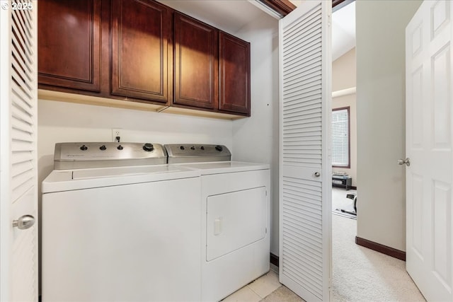 810 E 9th St Unit E18, Newberg, OR 97132 - laundry area featuring cabinet space, separate washer and dryer, light colored carpet, and baseboards