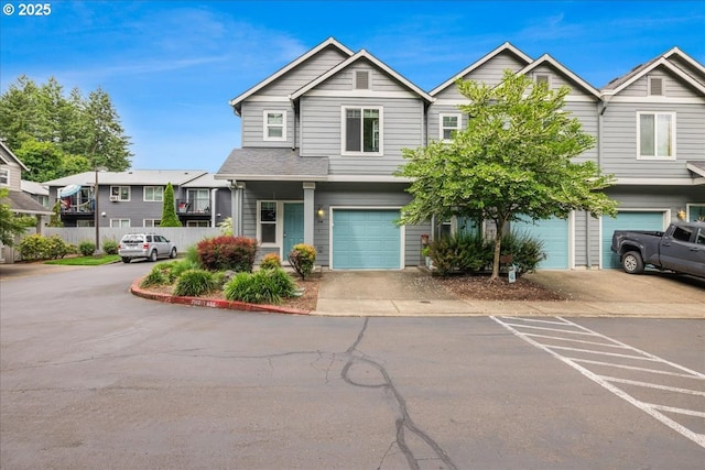 810 E 9th St Unit E18, Newberg, OR 97132 - view of front facade featuring an attached garage and driveway