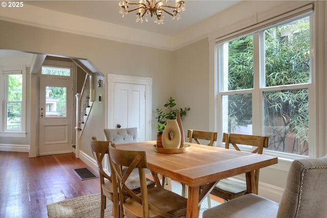 3324 SE Salmon St, Portland, OR 97214 - dining space with a chandelier, wood finished floors, and stairway