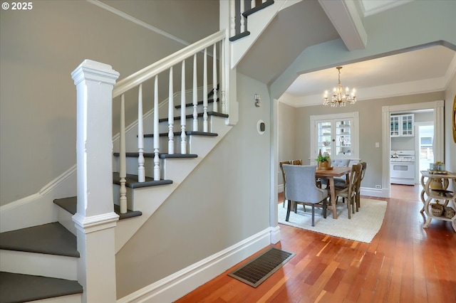 3324 SE Salmon St, Portland, OR 97214 - stairway featuring a chandelier and wood finished floors