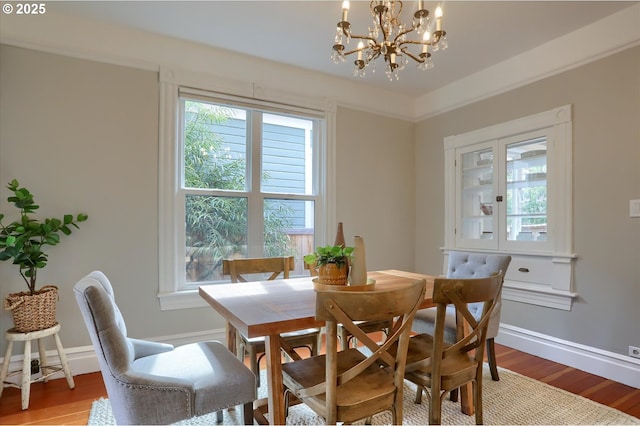 3324 SE Salmon St, Portland, OR 97214 - dining area with a chandelier, healthy amount of natural light, and light wood-type flooring