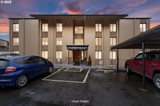 view of outdoor building at dusk