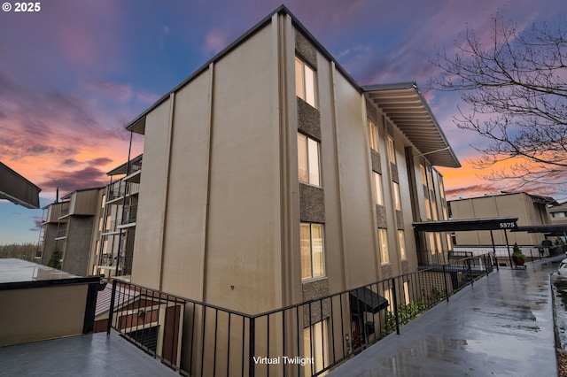 view of outdoor building at dusk