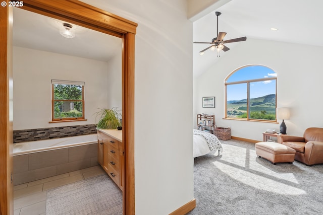 5331 Dolan Rd, The Dalles, OR 97058 - bedroom featuring lofted ceiling, light tile patterned floors, a ceiling fan, and light carpet