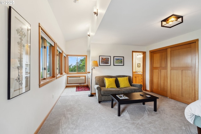5331 Dolan Rd, The Dalles, OR 97058 - living room with light carpet, a wall unit AC, baseboards, and vaulted ceiling