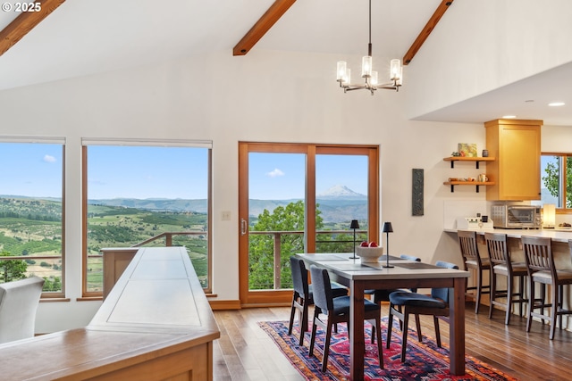 5331 Dolan Rd, The Dalles, OR 97058 - dining area featuring high vaulted ceiling, a mountain view, light wood-style floors, beamed ceiling, and a chandelier