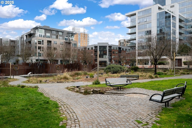 view of property's community featuring a lawn