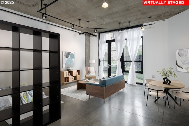 living area with concrete flooring