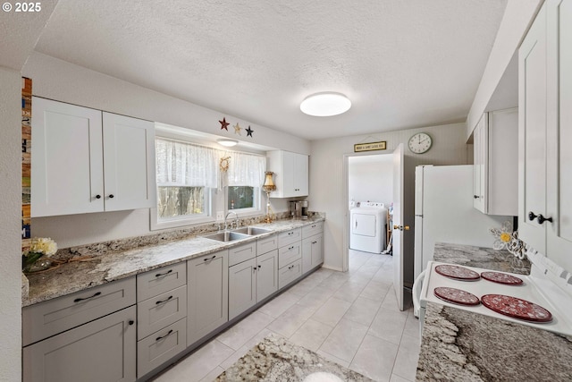 2720 Bowman Rd, Reedsport, OR 97467 - kitchen featuring a sink, electric range, a textured ceiling, gray cabinets, and light stone counters