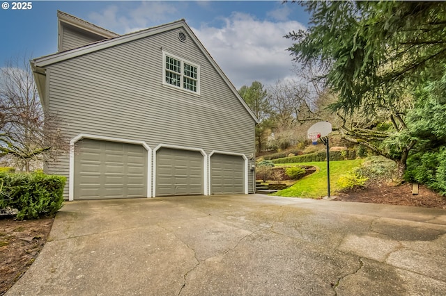 view of home's exterior featuring driveway and a garage