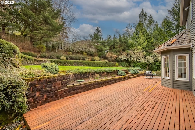 wooden terrace featuring fence