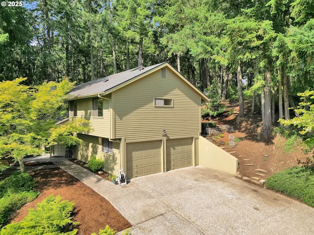 768 Brookside Dr, Eugene, OR 97405 - view of home's exterior featuring concrete driveway and a garage