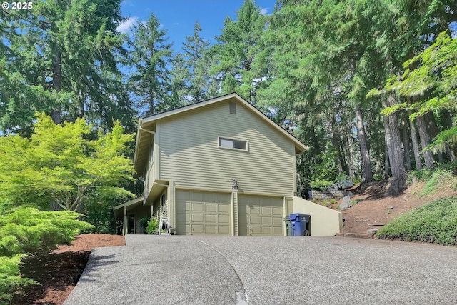 768 Brookside Dr, Eugene, OR 97405 - view of property exterior featuring driveway and a garage