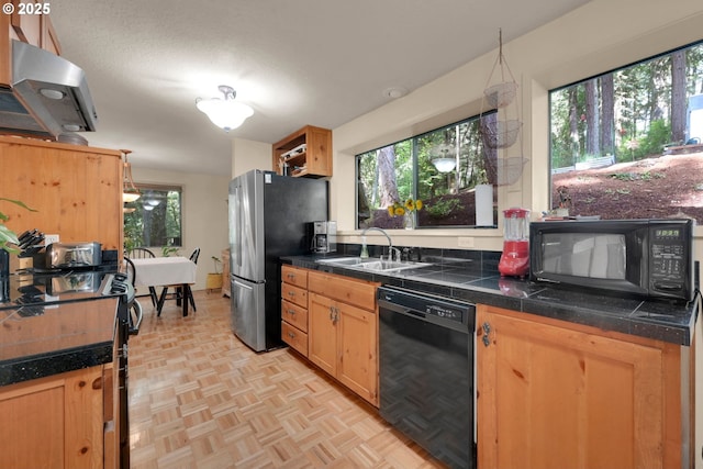 768 Brookside Dr, Eugene, OR 97405 - kitchen featuring black appliances, range hood, and tile counters