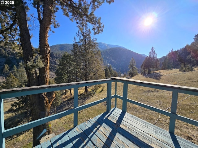 wooden terrace featuring a mountain view