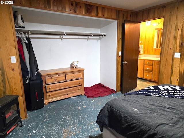 carpeted bedroom with wood walls