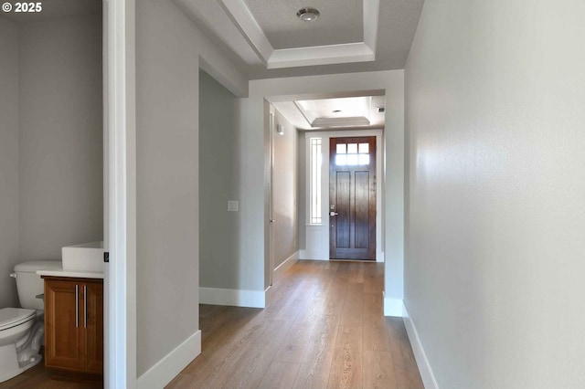 4909 NE 132nd Cir, Vancouver, WA 98686 - foyer entrance featuring a raised ceiling, light wood-type flooring, and baseboards