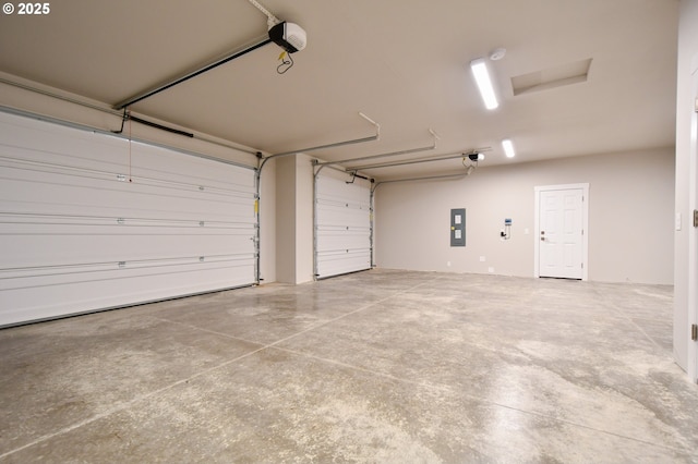 garage with electric panel and a garage door opener