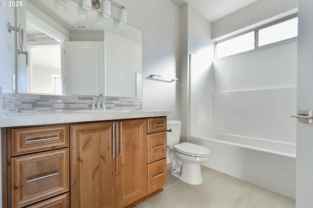 4909 NE 132nd Cir, Vancouver, WA 98686 - bathroom with toilet, vanity, tile patterned floors, backsplash, and  shower combination