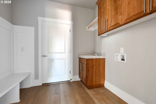 4909 NE 132nd Cir, Vancouver, WA 98686 - clothes washing area with wood finished floors, washer hookup, and cabinet space