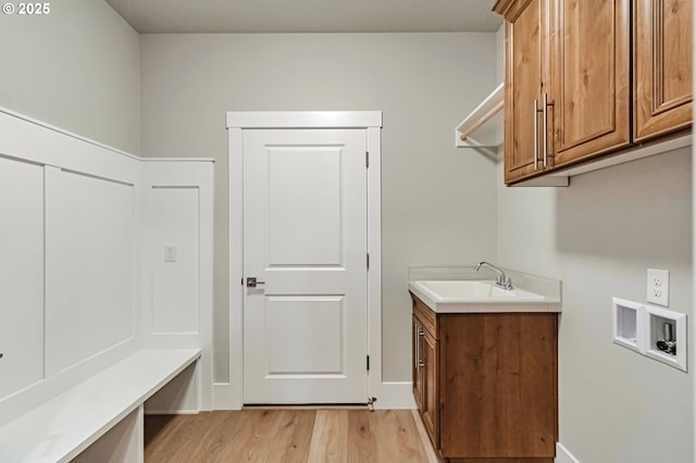 4909 NE 132nd Cir, Vancouver, WA 98686 - laundry area featuring hookup for a washing machine, light wood-style floors, and cabinet space