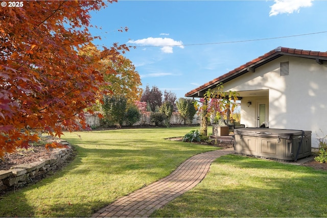 view of yard featuring a hot tub