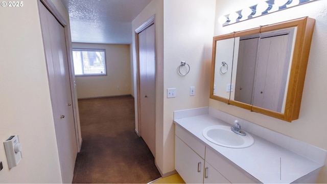 bathroom featuring vanity and a textured ceiling