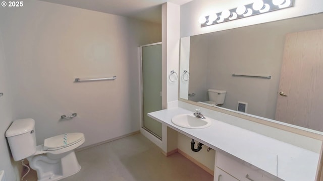 bathroom featuring an enclosed shower, sink, and toilet