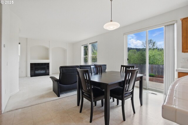 15820 SW Towhee Ln, Beaverton, OR 97007 - dining room with a tiled fireplace and light carpet