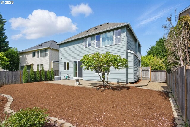 15820 SW Towhee Ln, Beaverton, OR 97007 - back of property featuring a patio, a fenced backyard, and central AC unit