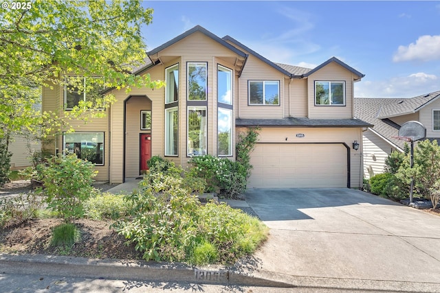 view of front of property featuring an attached garage and concrete driveway